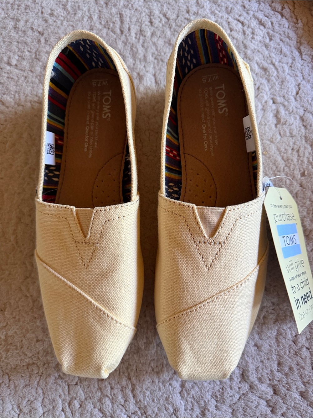 TOMS Slip-On Canvas Shoes in Pale Yellow with Striped Lining